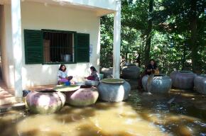 Cooking lunch amid the flood waters